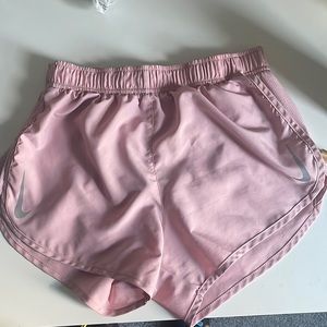 Pink Nike Dri-Fit workout shorts